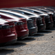 This picture taken on March 17, 2015, shows Tesla Model S vehicles parked outside a car dealership in Shanghai.